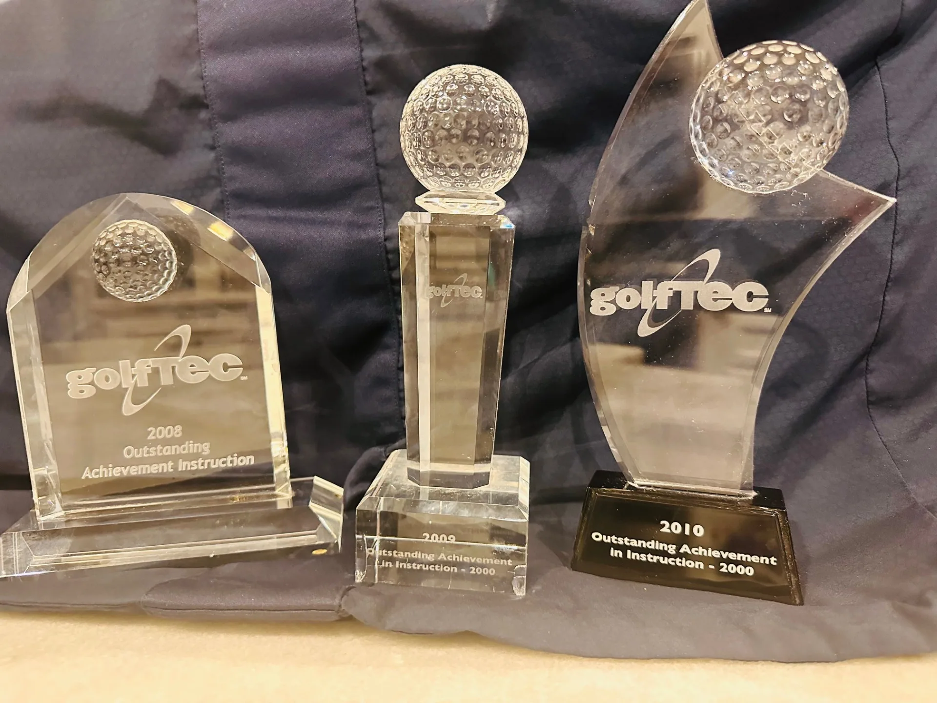 Ryan's three GOLFTEC Outstanding Achievement in Instruction awards from 2008, 2009, and 2010.
